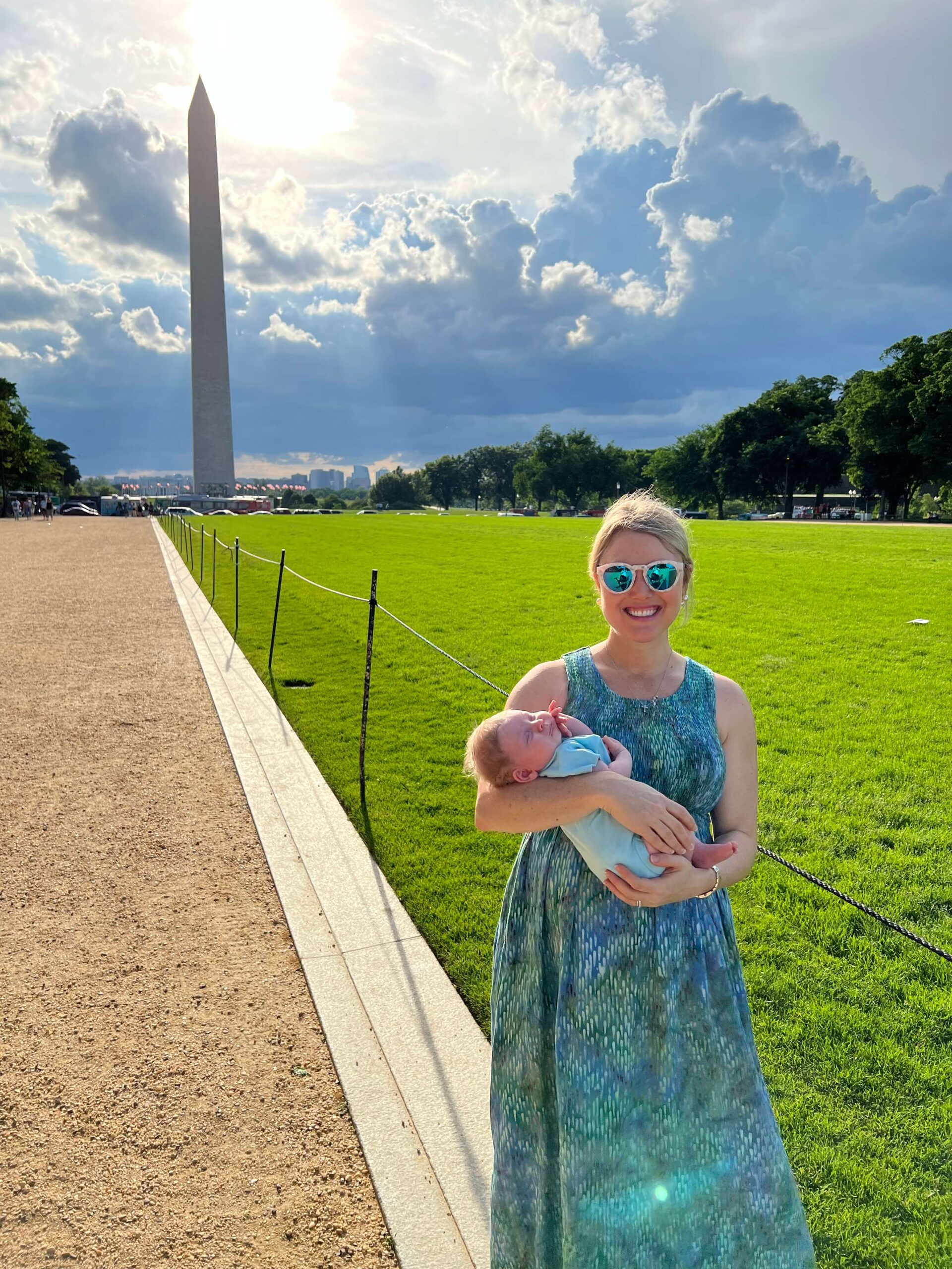 Mother and her baby in front of the Washington monument in DC